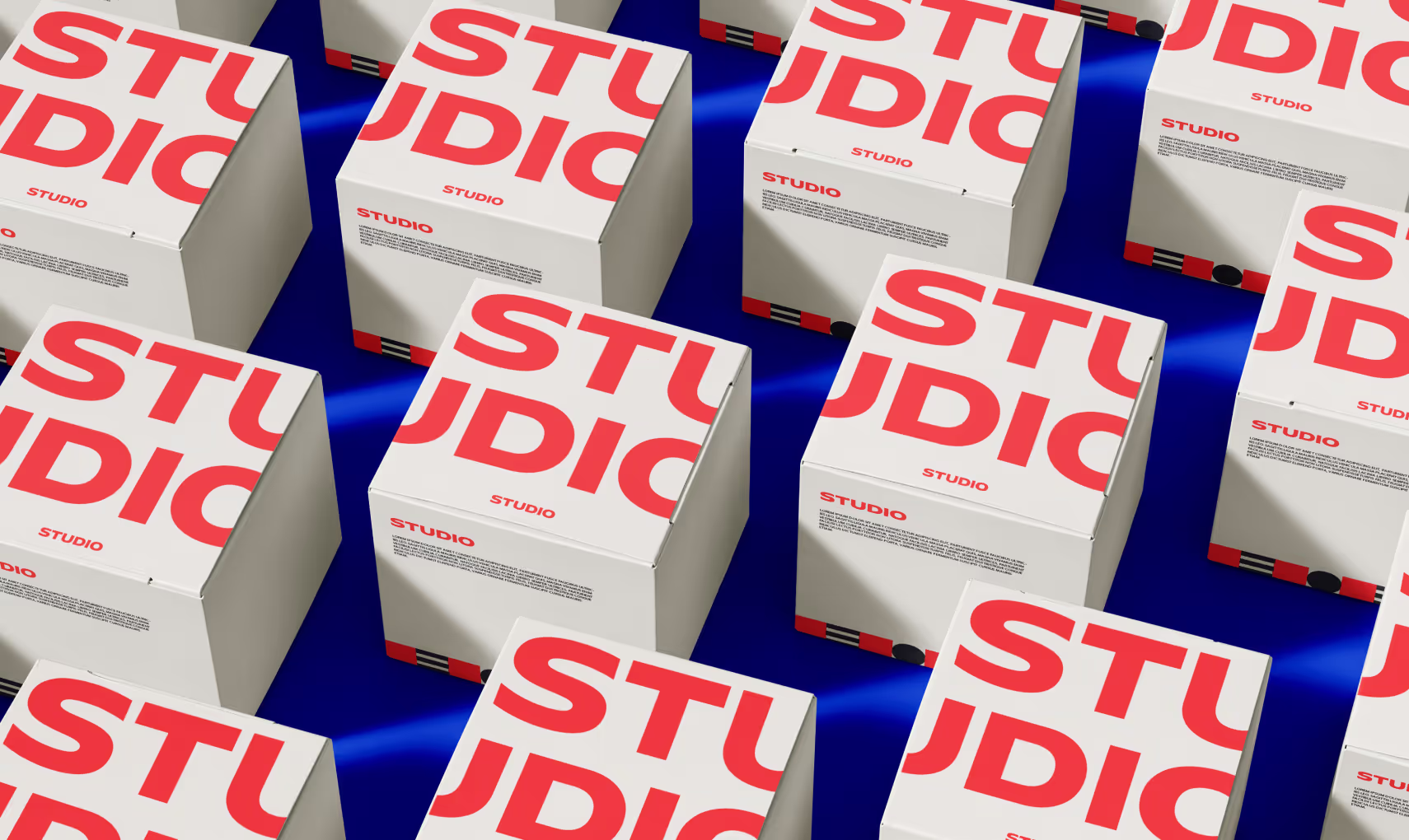 Rows of Studio boxes in red and white on a blue backdrop