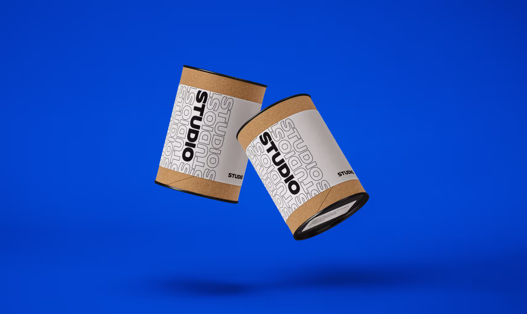 Two Studio-branded canisters floating against a blue backdrop